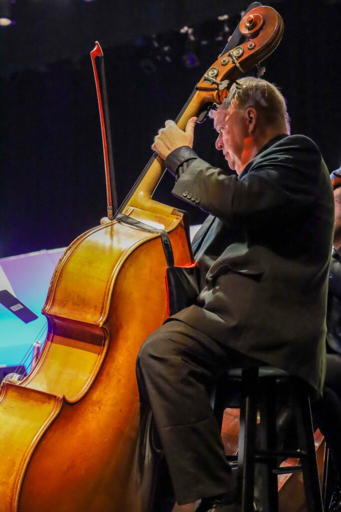 A Man Playing a Cello Side View Shot