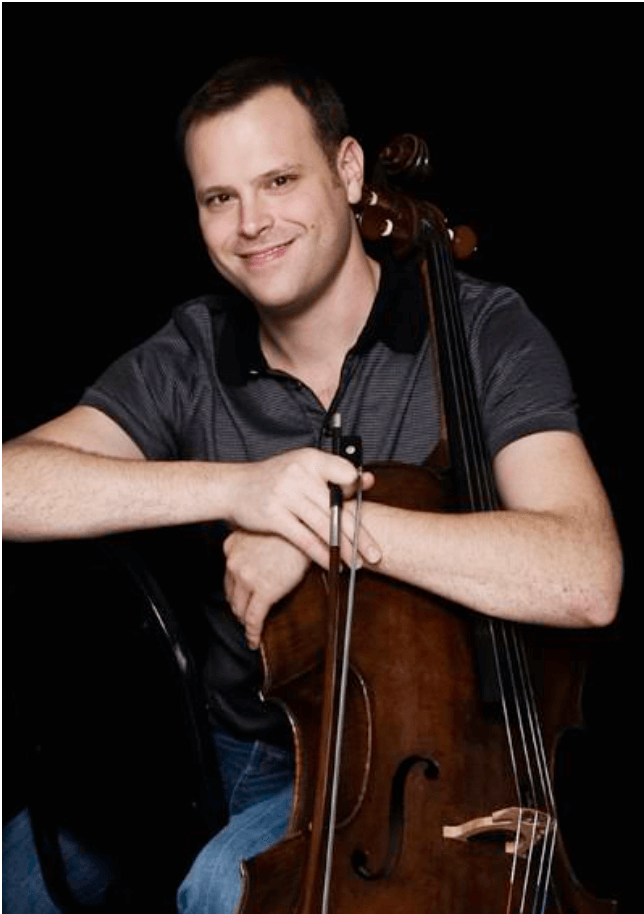 Aaron Merritt Holding a Cello Headshot