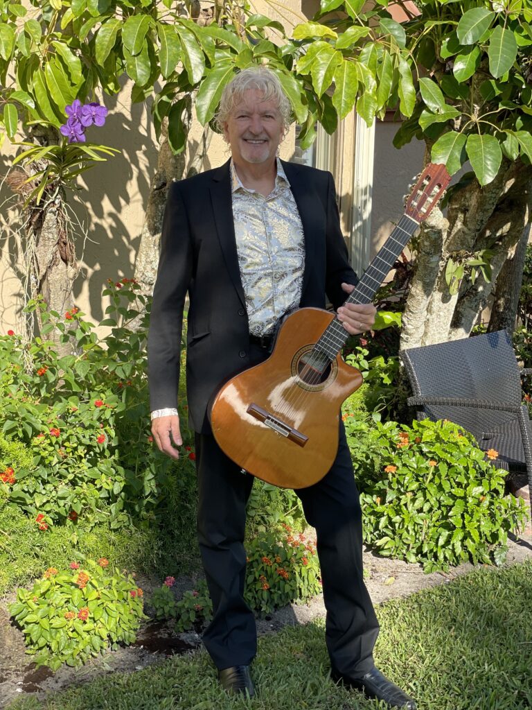 Martin Hand holding a beautiful guitar